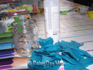 Using glue and water mix to stick tissue paper to and varnish a tea light holder