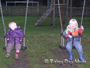 Siblings enjoying the playground together