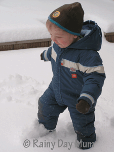 Toddler walking in the snow