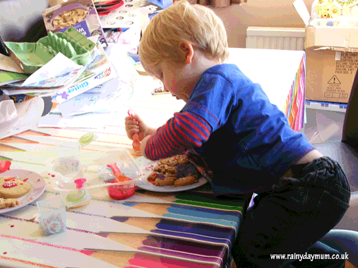 Toddler decorating easter cookies