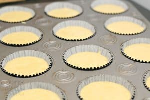 cupcake cases filled with cupcake batter