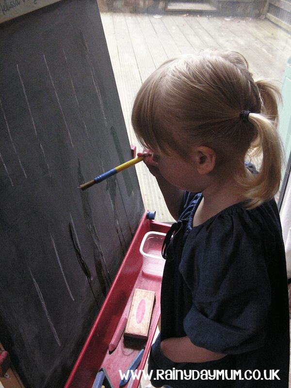 Developing prewriting skills on the chalk board with draw and erase