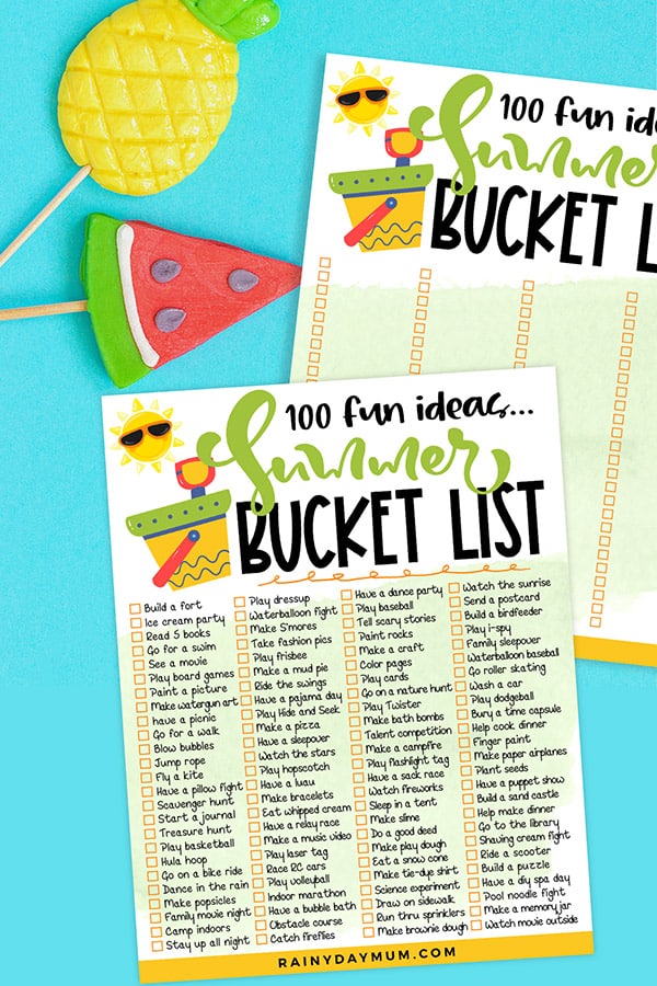 flat lay of the free printable summer bucket list with cute summer fruit puppets on a blue background