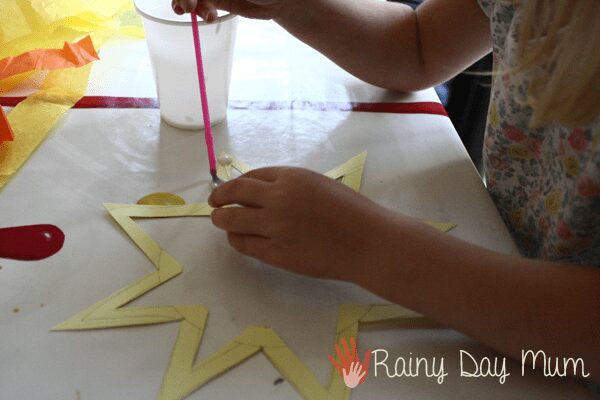 Celebrate Summer by creating a sun shaped sun catcher - perfect for Summer Solstice