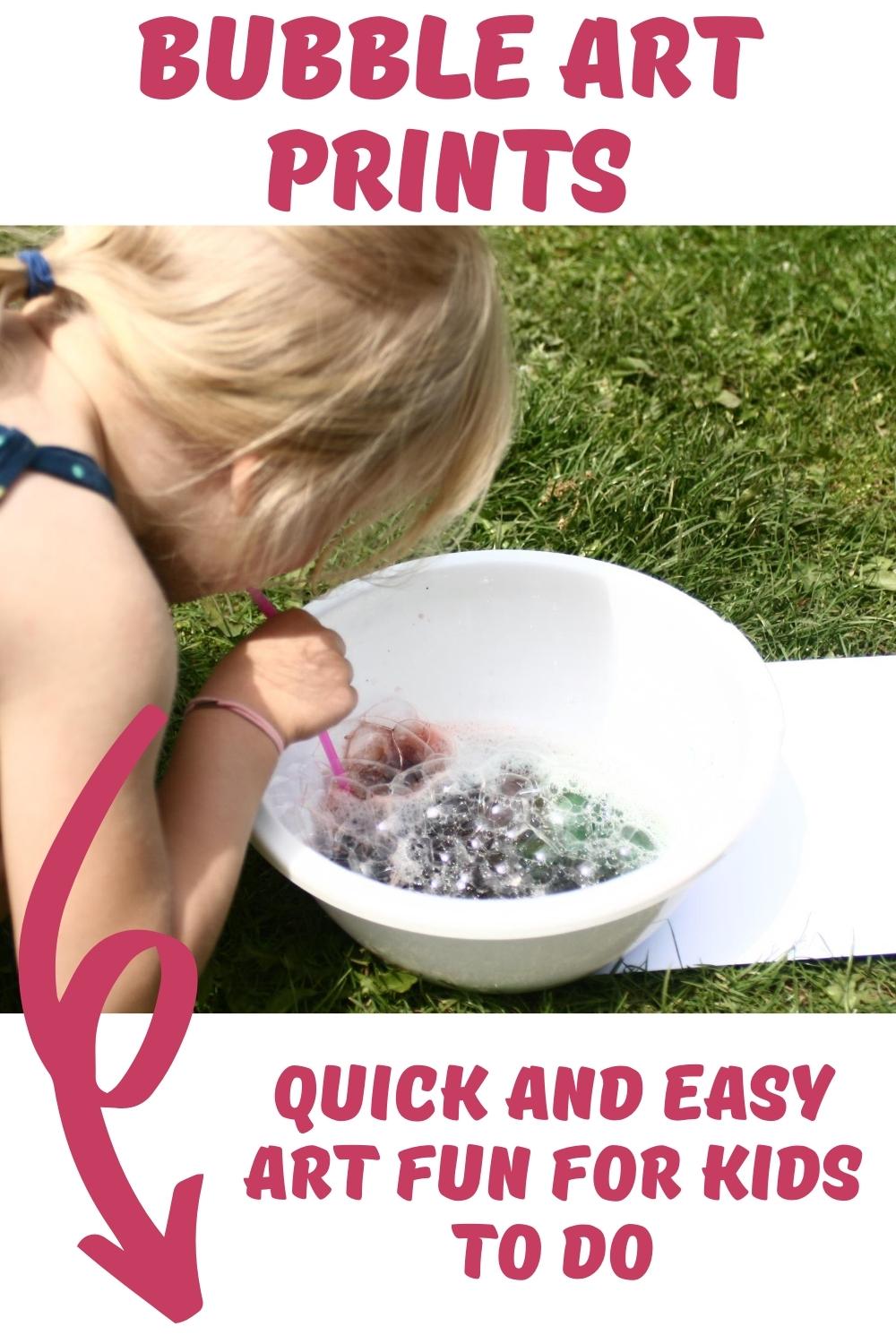 Pinterest image of a young preschoolers making bubble prints blowing in a straw into a bowl of soapy coloured water. Text reads Bubble Art Prints quick and easy art for kids to do.