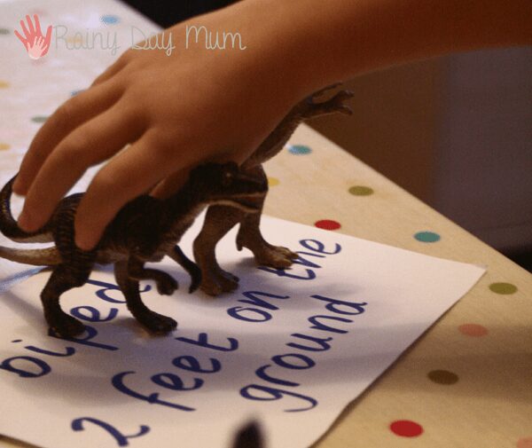 Classification and sorting of dinosaurs working on science and math knowledge with preschoolers