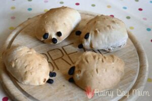 4 hedgehog shaped bread rolls on a bread board cooked by a toddlers in autumn