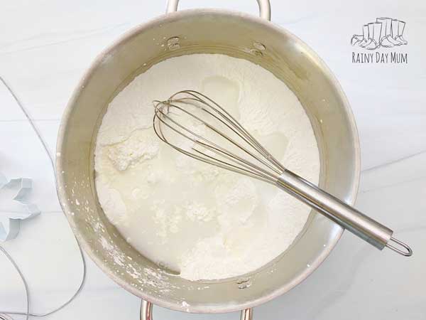 mixing the 3 ingredients for cornflour clay together in a pan