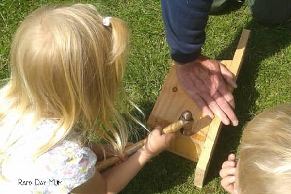child making a nest box in the summer