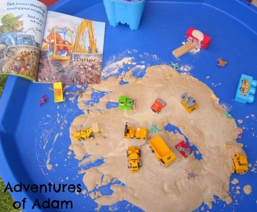 Dinosaur small world play connect and play with the children's storybook Dinosaur Dig! using Kinetic Sand
