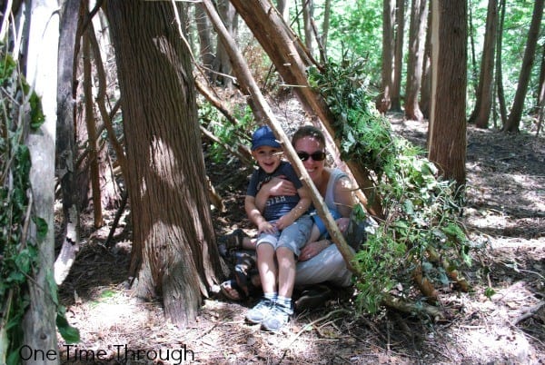 building a den in the forest a simple STEM activity you can easily do outside in the spring