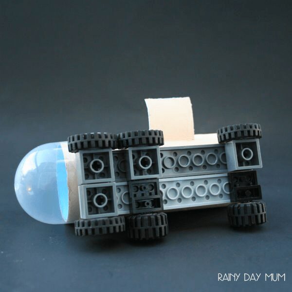 Lego added to the base of a cardboard tube to create a mini Mars rover 