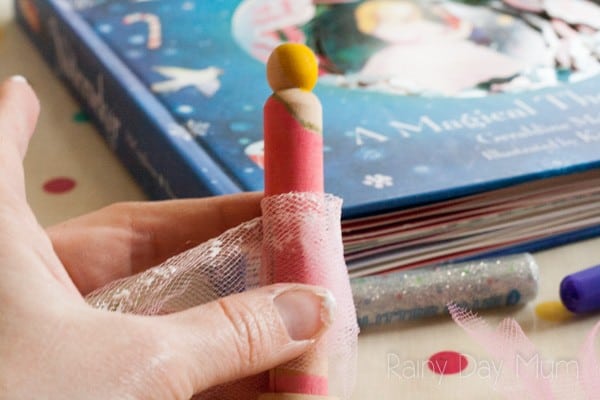 adding a tutu to the nutcracker peg doll DIY that is so simple kids can make it too