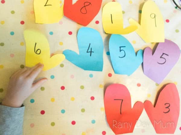 DIY math game for early years ideal for winter or to accompany the book The Mitten by Jan Brett. Working on Numbers Bonds match the pair of mittens left and right hand to make the number bonds.