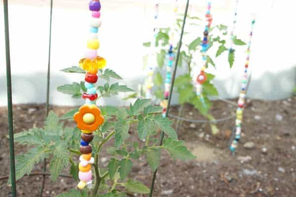 DIY Whimsical beaded garden ornaments - keep the colours of summer throughout the year in the yard or garden with these simple summer craft for kids and get them to create their own Beaded Garden Ornaments