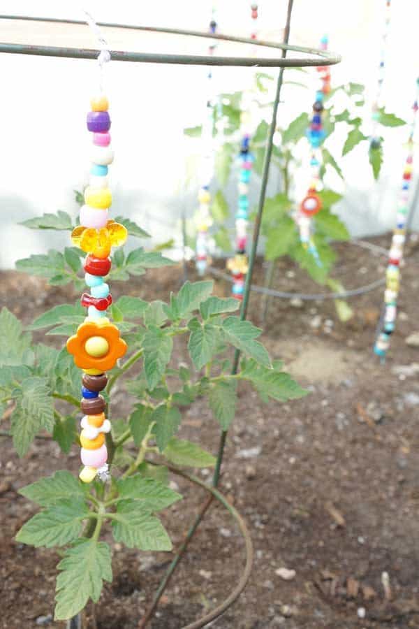 DIY Whimsical beaded garden ornaments - keep the colours of summer throughout the year in the yard or garden with these simple summer craft for kids and get them to create their own Beaded Garden Ornaments
