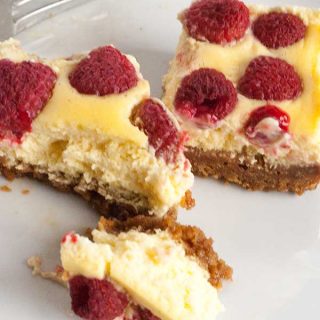 Delicious summer dessert recipe for Raspberry and Vanilla Cheesecake Bars with a gingernut crust