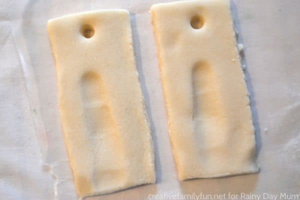 simple salt dough ornaments with holes for hanging on the tree ready to go in the oven
