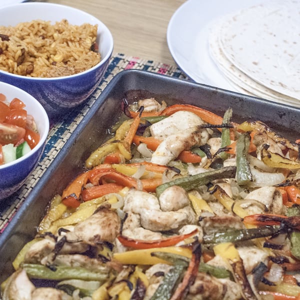 Simple to make ahead chicken fajitas recipe that makes a perfect easy mid-week family meal for everyone to enjoy. Straight from the oven to table.