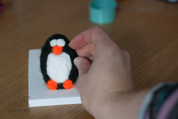 This easy needle felted penguin Christmas tree decoration is an ideal beginner project for yourself of the kids to give needle felting a try.