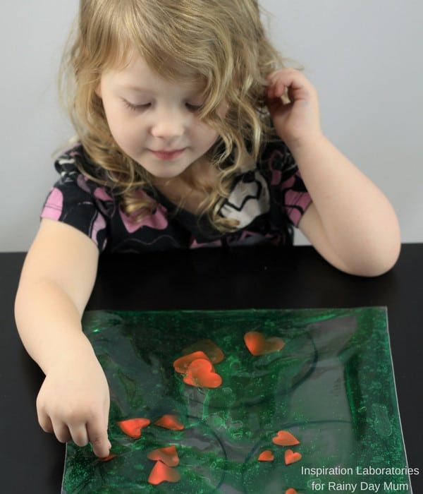 Create your own simple sensory bag for toddlers and preschoolers inspired by How the Grinch Stole Christmas and use it for a shape sorting activity or more.