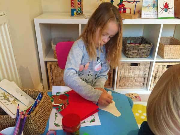Christmas inspired art and craft activity for kids of different ages to do together. Full instructions on setting up your own Christmas Card Creation Station with ideas for resources to include.