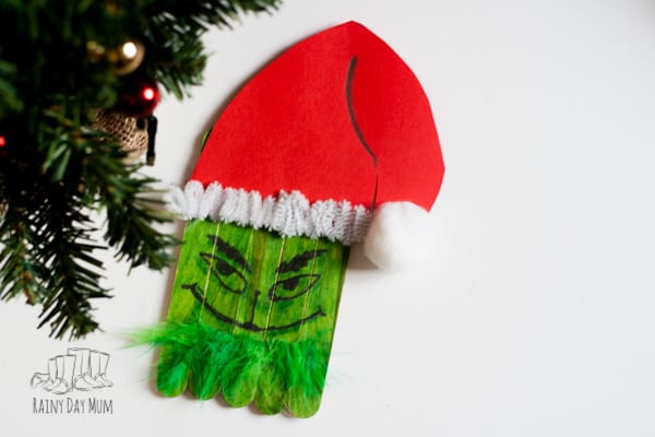Easy Popsicle Stick Craft for toddlers and preschoolers to create a Grinch perfect for some book or movie inspired creativity leading up to Christmas.