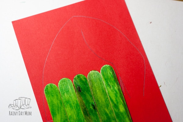Easy Popsicle Stick Craft for toddlers and preschoolers to create a Grinch perfect for some book or movie inspired creativity leading up to Christmas.