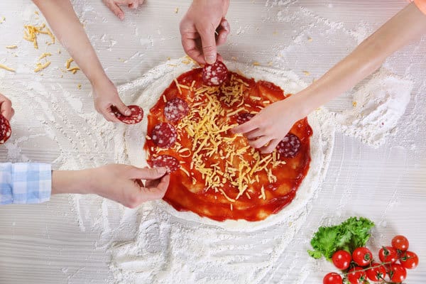 A simple recipe for making pizza dough - so easy that kids can make it themselves. Use your bread machine to get delicious pizza dough perfect for pizza night that the family can enjoy.