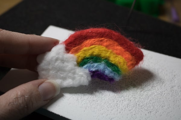 Step-by-step guide to creating a simple needle felted rainbow ideal as a beginner project and perfect for some spring or St Patrick's Day inspired crafting.