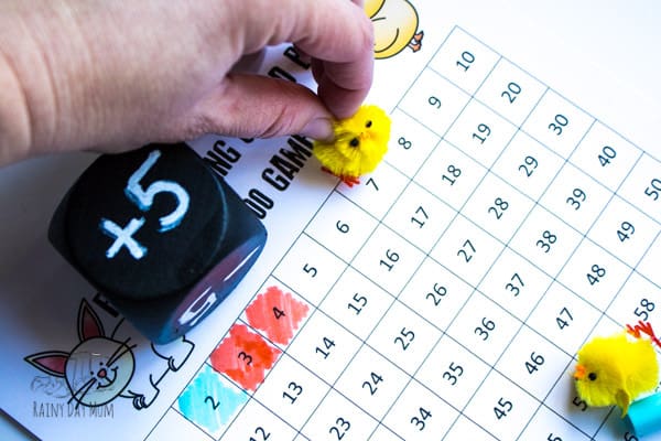 Easter-themed printable hundred chart game for practising addition and subtraction with 1, 2's and 5's. Download and print the chart and use our reusable die instructions to create a simple multi-player maths game to race to 100.