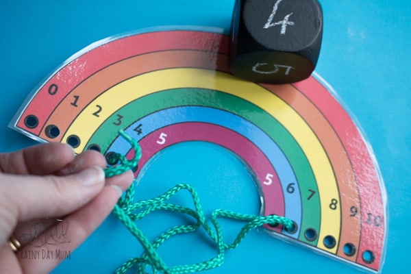 Work on reinforcing number bonds to 10 with this rainbow lacing activity including free printable lacing rainbow. Perfect for helping with number sense and mental arithmetic by getting hands-on learning of the basic number facts.
