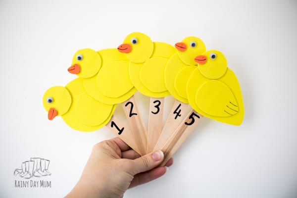 set of handmade simple craft foam duck puppets on sticks for the nursery rhyme five little ducks