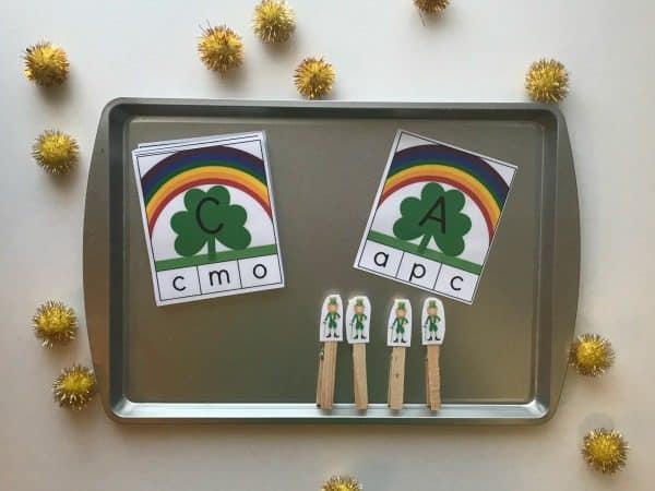 invitation to learn tray set up for St Patrick's Day with upper and lower case letter match cards and clothes pins with leprechauns on to match the letters.