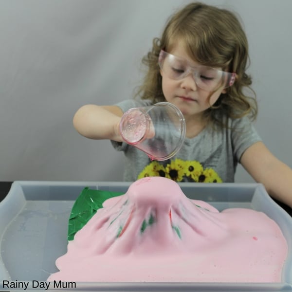 Explore how volcanoes differ with this fun hands-on volcano science experiment for kids. Use the classic baking soda experiment with variations to see if you can create an explosive volcano or a slow flowing lava field. Ideal for hands-on Earth Science learning.