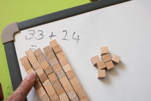 addition problems solved using base 10 blocks at home