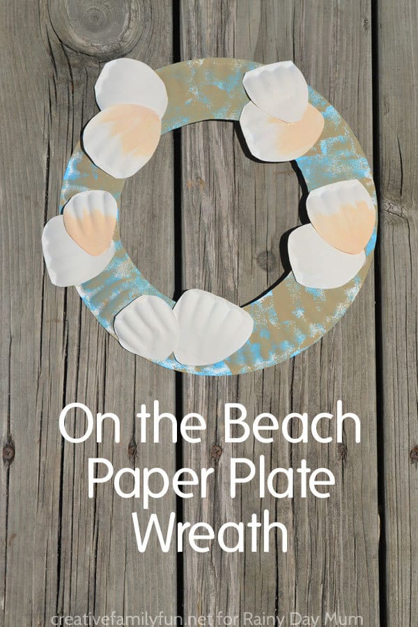Easy and quick summer craft for kids to make an ocean or beach themed paper plate wreath with 3D shells.