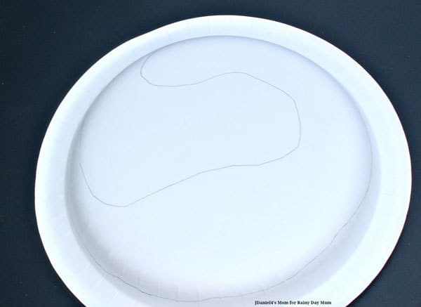 dinosaur outline on a paper plate