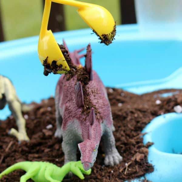 Pretend play with dinosaurs inspired by the book Dinosaur Farm