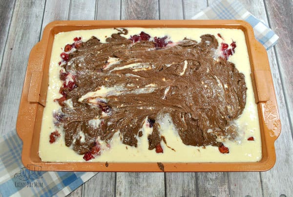 Creating a marbled topping for the cherry pie cheesecake bars