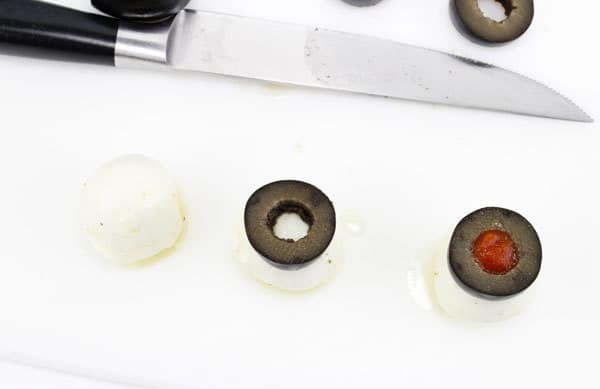 step by step pictures for creating mozzarella eyeballs for halloween meals