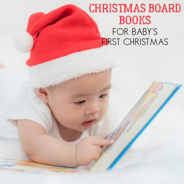 Baby reading a Christmas Board Book