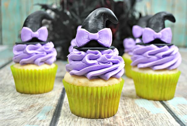 little witch halloween party cupcakes with pretty purple bows