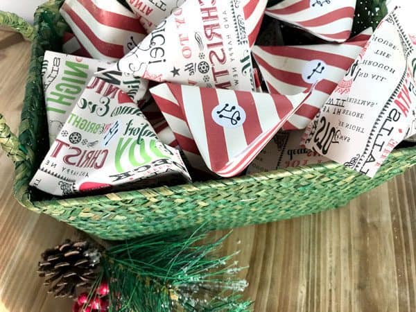 Paper Pocket Advent Calendar in a green wicker basket ready to countdown to Christmas
