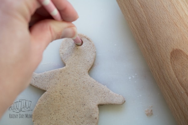 Adding a straw to make the Christmas salt dough ornaments easy to hang on the tree