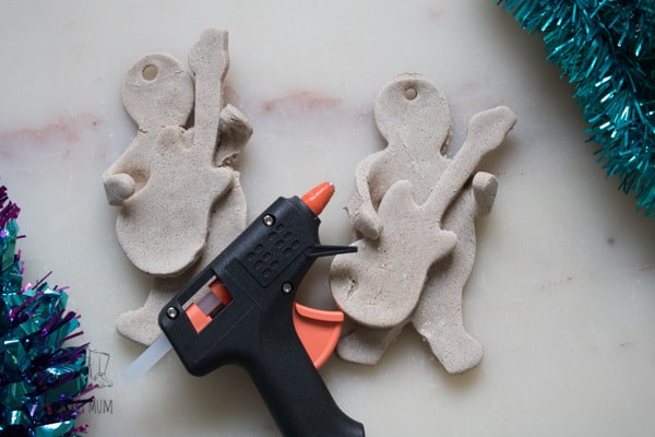 Using a hot glue gun to create 3D ornaments from Salt Dough for the Christmas Tree
