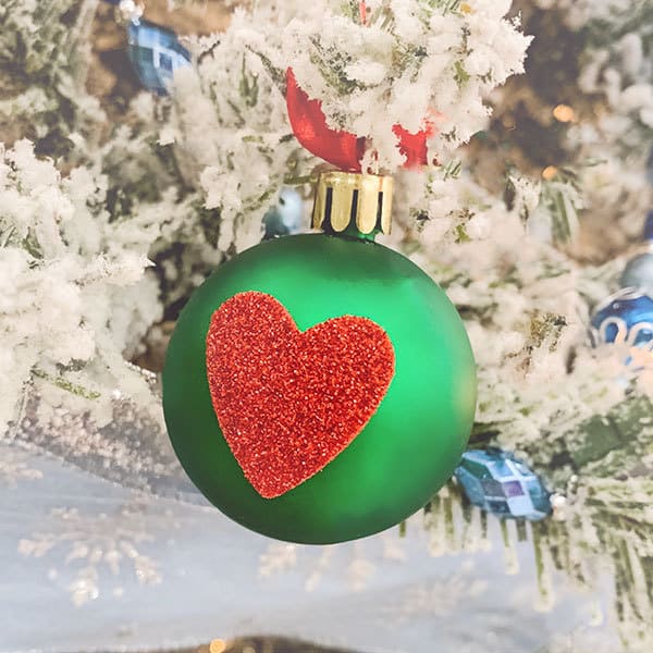 Quick and easy toddler craft inspired by How the Grinch Stole Christmas to create baubles for the tree