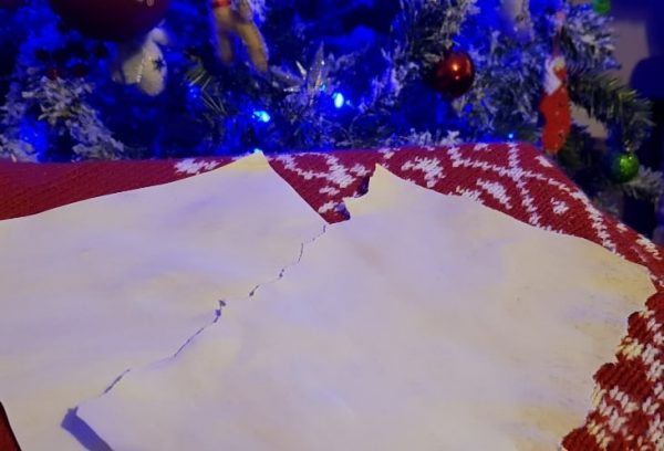 torn paper edges on Christmas letters from Santa to your own child a DIY Tutorial on keeping Christmas Magical