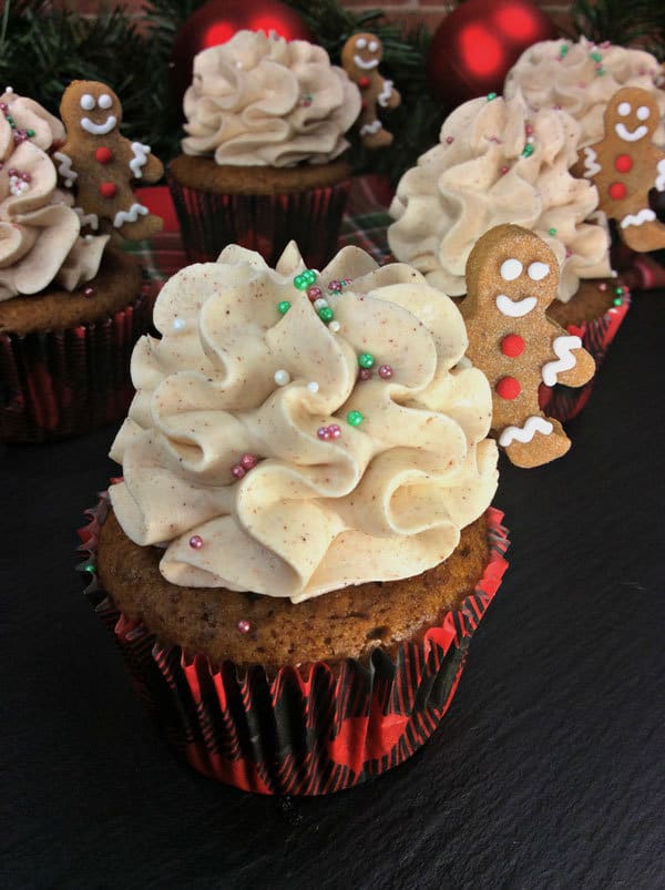 Delicious Cinnamon Frosting with mini Gingerbread Men on Gingerbread Cupcakes for Christmas in Tartan Cupcake Cases