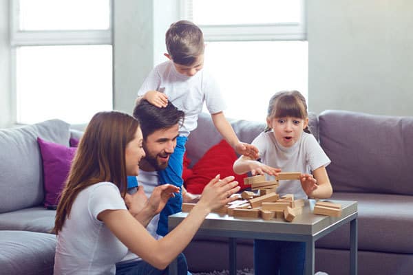 spend time as a family playing board games in the winter indoors